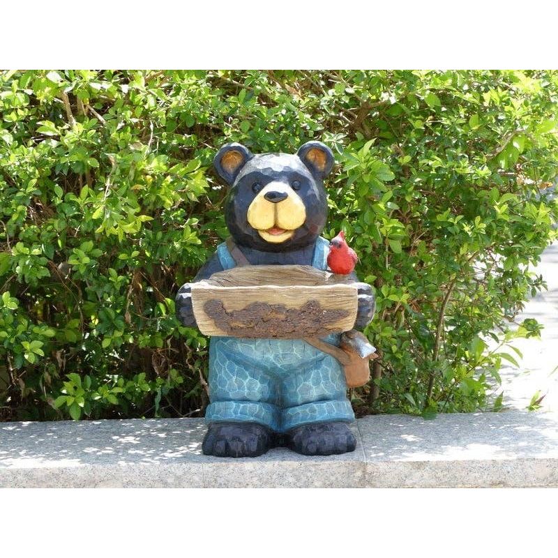 Bear Holds Bird Bath With Cardinal