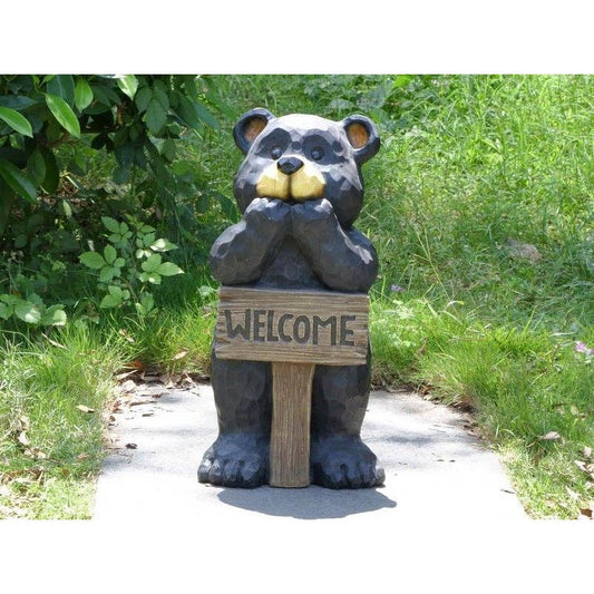Bear Leans On Welcome Sign